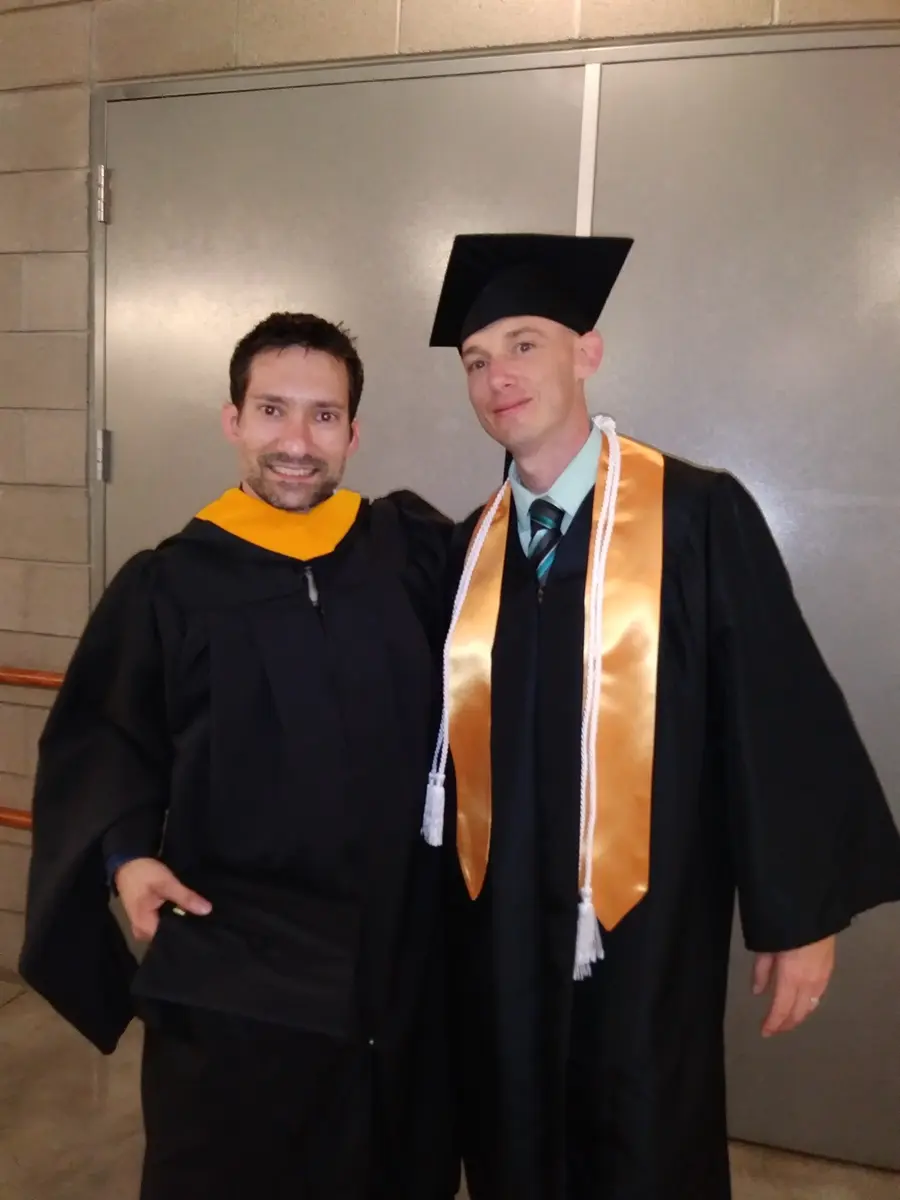 Bruce Franse at Bryan University graduation with professor Chris Bigelow