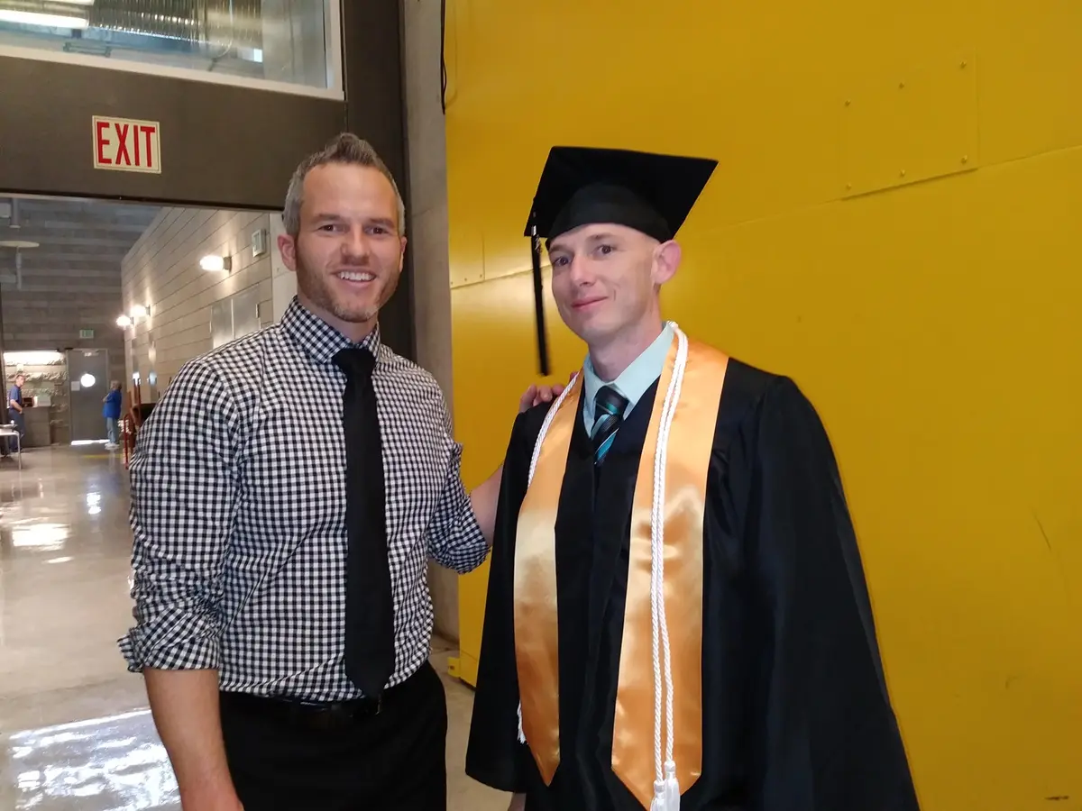 Bruce Franse at Bryan University graduation with professor Sean Preuss